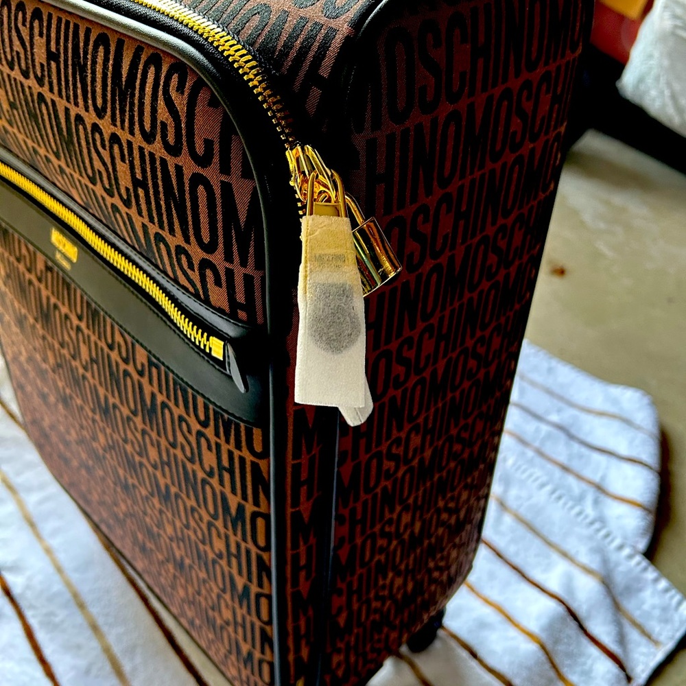 Moschino 18 Inch Logo Spinner Swuitcases each sold separately 500each or 900both